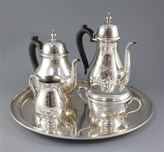 A 20th century matched Tiffany & Co sterling silver four piece tea set and circular tray, gross 114.5 oz.